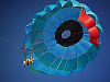 big-island-hawaii > Parasail floating in the blue sky of the Big Island