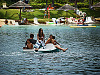 big-island-hawaii > Boys and girls floating on a pedalo in the Waikoloa Village lagoon
