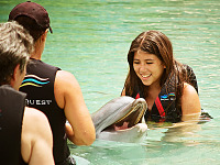 big-island-hawaii > Young girl interacting with the dolphin