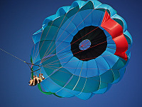 big-island-hawaii > Parasail floating in the blue sky of the Big Island