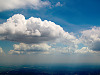 clouds-sky > Texas Country in Shadows of Bright Clouds
