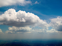 clouds-sky > Texas Country in Shadows of Bright Clouds