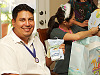 pflugerville-texas > Tony, dad to be, showing Pooh gift