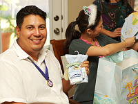 pflugerville-texas > Tony, dad to be, showing Pooh gift