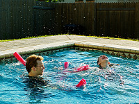 pflugerville-texas > Gabriel and Leandra having fun in swimming pool