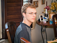 pflugerville-texas > Gabriel sitting at the Thanksgiving dinner table