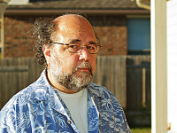 pflugerville-texas > Michael serious on the patio at sunset